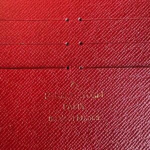 Louis Vuitton Red Textured Leather Card Sleeve with Black Interior
